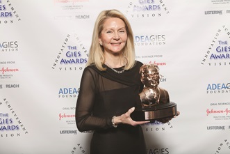 Dean Kassebaum holds the 2013 Gies Award