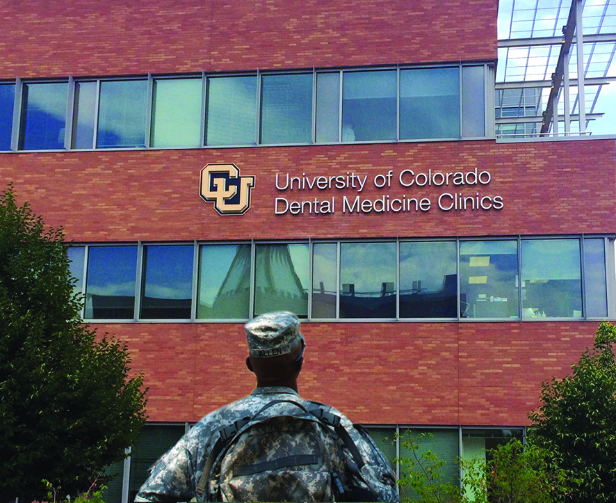 Veteran walking to entrance of Heroes Clinic