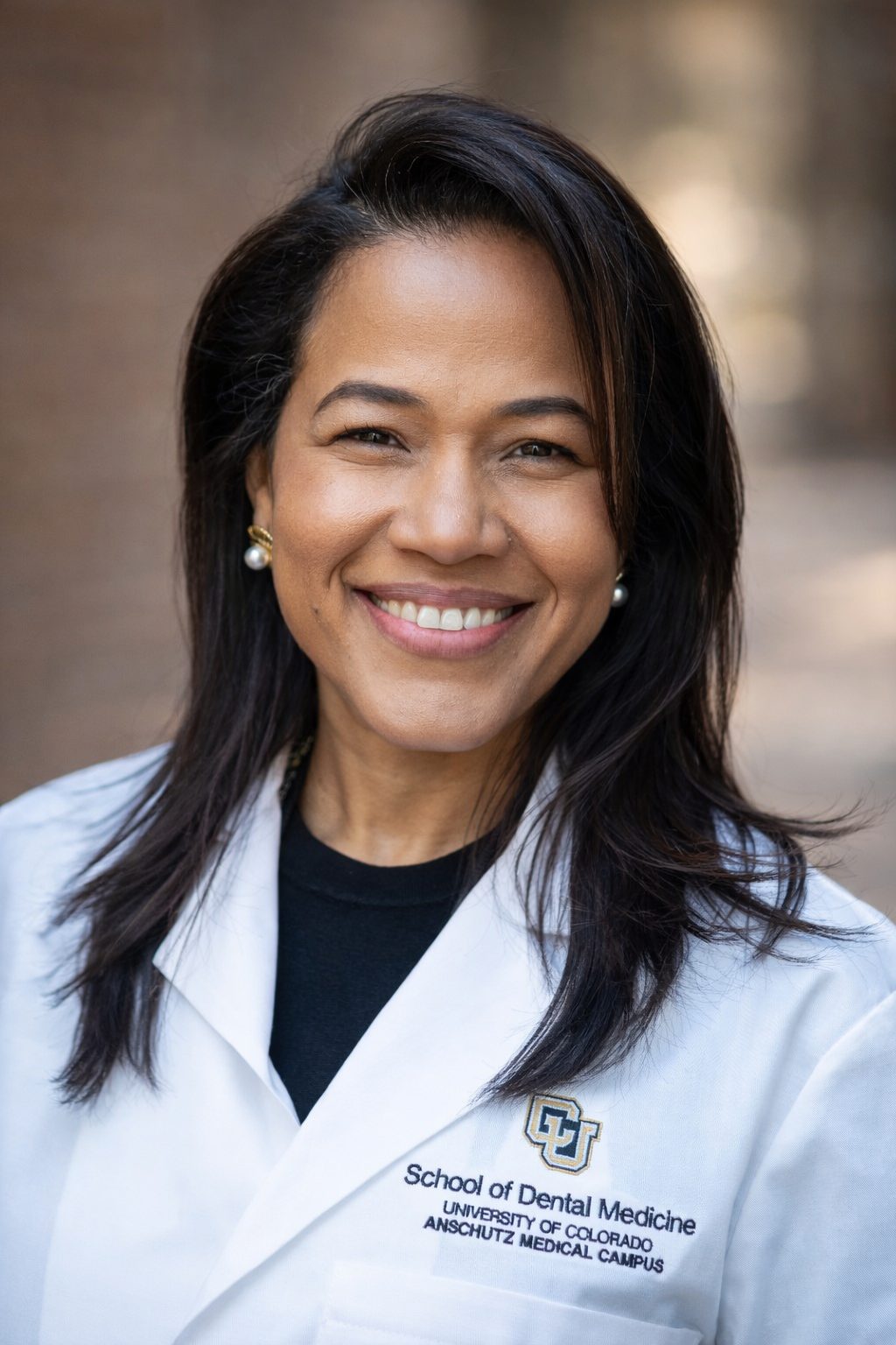 professional headshot of Dr Annetty Soto in white coat